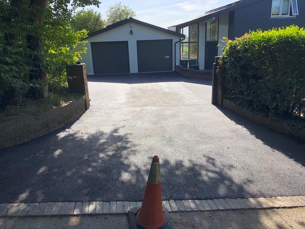 This is a photo of a bitumen driveway which is in the process of being installed by Wagga Wagga Road Tech